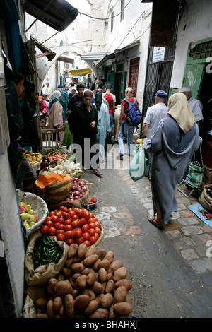 Fruit and vegetables for sale at a produce stall along one of the many narrow alleys at the casbah in Tetuon, Morocco. Stock Photo