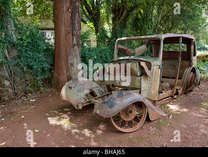 Exhibiting remains of cute rusty old abandoned car at Pilgrims Rest used by early gold mining European settlers in South Africa. Stock Photo
