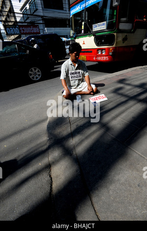 Beggar in Bangkok,Thailand. Stock Photo