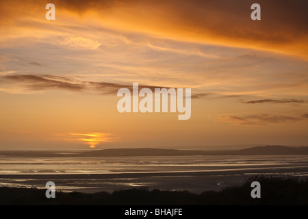 Sunset view across Morecambe Bay from Eaves Wood, Silverdale, Lancashire, England Stock Photo