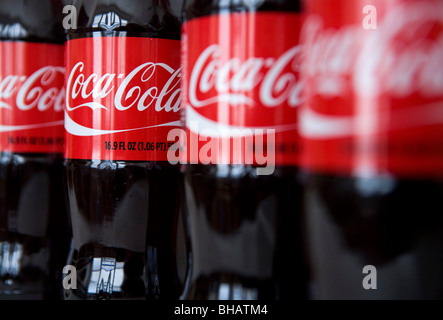 A grouping of Coca-Cola bottles.  Stock Photo