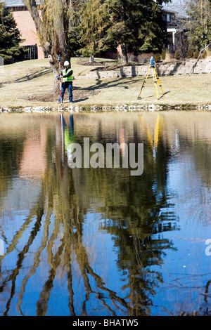 Taking measurements by the lake Stock Photo