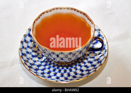 A cup of tea in a fine porcelain cup and saucer Stock Photo