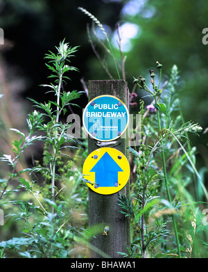 A bridleway sign on an overgrown footpath in the countryside near Rugby, Warwickshire. Stock Photo