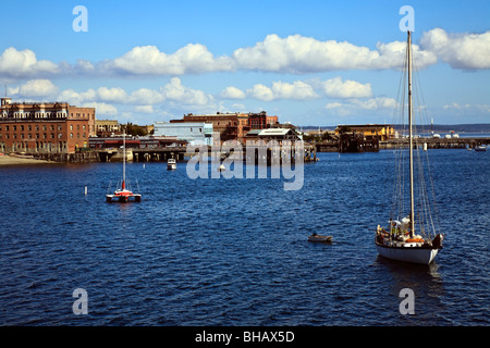 Port Townsend waterfront from Puget Sound with boats anchored in foreground Stock Photo