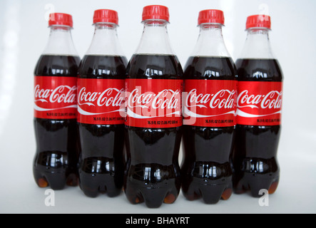 A grouping of Coca-Cola bottles.  Stock Photo