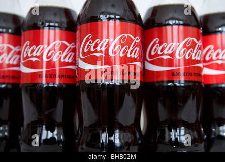 A grouping of Coca-Cola bottles.  Stock Photo