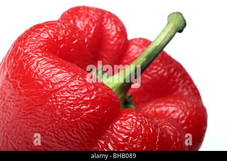 Old wrinkled paprika on white Stock Photo