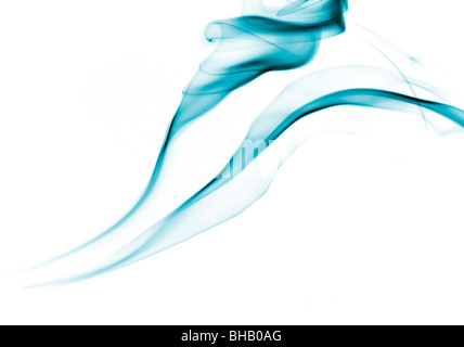 Blue smoke trails against a white background Stock Photo