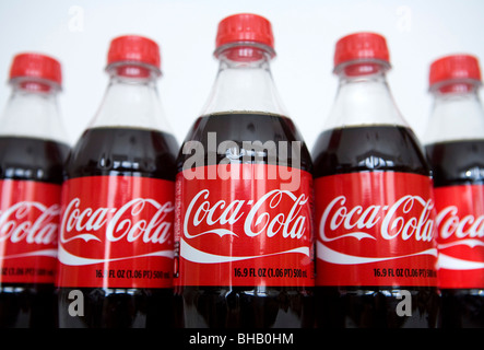 A grouping of Coca-Cola bottles.  Stock Photo