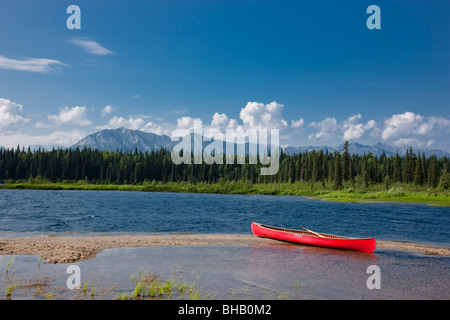 Red canoe on the shore of Byers Lake, Summer, Denali State Park, Southcentral Alaska Stock Photo