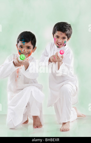 Two boys playing with pichkaris