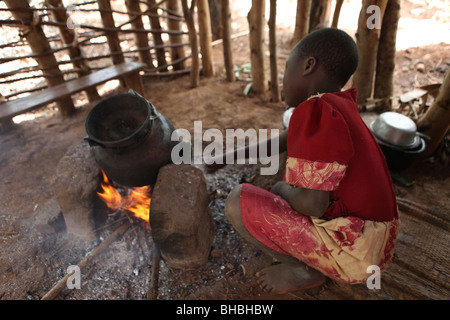 Africa african africans burundi campfire child children civil war conflict cook cooking cooking pot displaced displaced camp dis Stock Photo