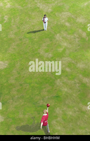 bowler bowling at person Stock Photo