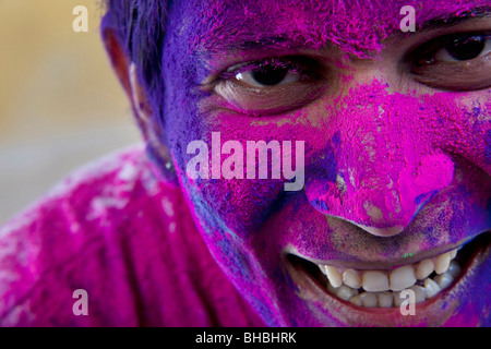 Man's face covered in holi colours Stock Photo