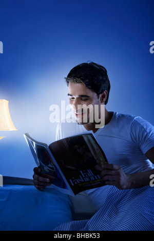 Man reading a magazine Stock Photo