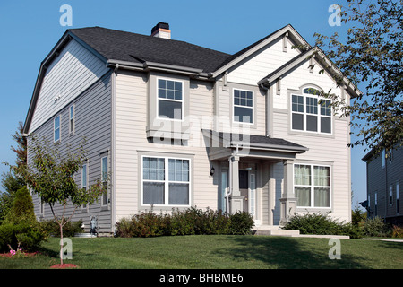 Home in suburbs with gray and white siding Stock Photo