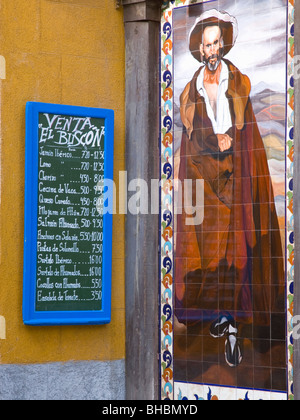 Madrid, Spain. Menu board and tilework on wall of traditional tavern in the Huertas district. Stock Photo