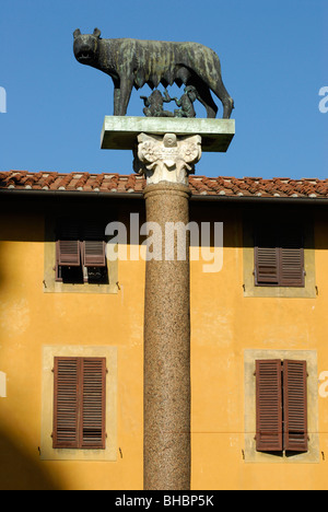 statue of Romulus & Remus suckling on the Wolf in the Plaza of Miracles beside the Leaning Tower of Pisa. Stock Photo