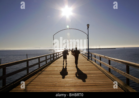 Joggers on the pier at White Rock, British Columbia, Canada. Stock Photo