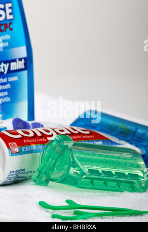 Toothpaste tooth paste tube with squeezer dispenser a toothbrush     personal oral hygiene products health dental care items vertical in USA US hi-res Stock Photo