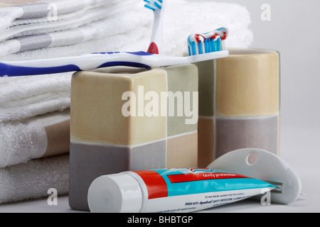 Toothpaste tooth paste tube with squeezer dispenser a toothbrush  personal oral hygiene products health dental care items horizontal in USA US hi-res Stock Photo
