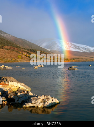 Rainbow with reflection and snow in mountains at Mono Lake. California. Stock Photo