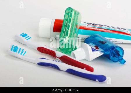 Toothpaste tooth paste tube with squeezer dispenser a toothbrush  personal oral hygiene products health dental care items horizontal in USA US hi-res Stock Photo