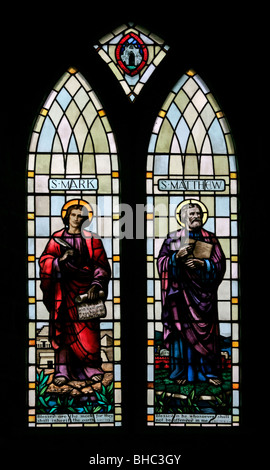 A stained glass window by Edward Liddall Armitage depicting Saints Mark and Matthew, St Mary's Church, Leake, North Yorkshire Stock Photo