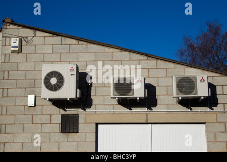 Mitsubishi Air Conditioning on a factory wall Stock Photo