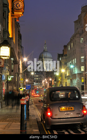 Night time taxi in Fleet Street with St Paul's Cathedral and Ludgate Hill, London EC4A, United Kingdom Stock Photo