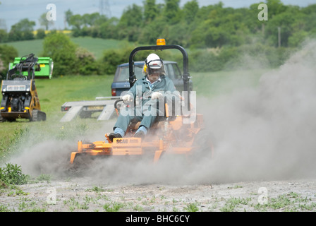 Trimming grass with a Scag diesel Stock Photo