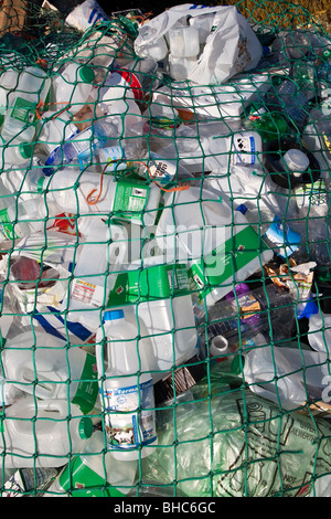 Plastic waste for recycling at recycling collection station in car park UK Stock Photo