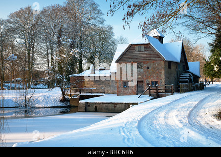 Watermill on the River Thames at Mapledurham Estate in the snow, Berkshire, Uk Stock Photo