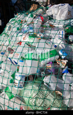 Plastic waste for recycling at recycling collection station in car park UK Stock Photo