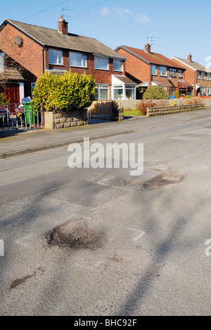 Pothole in road surface on road in Cheshire, UK. Stock Photo