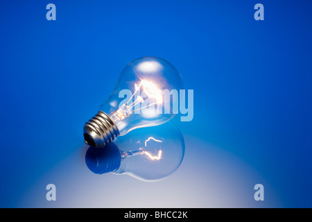 Clear Standard Light Bulb Illuminated Stock Photo