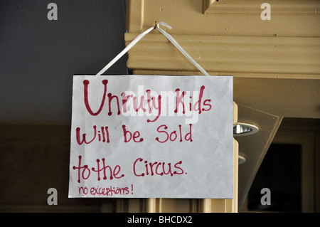 Note in museum saying 'Unruly kids will be sold to the circus. No exceptions.' Stock Photo