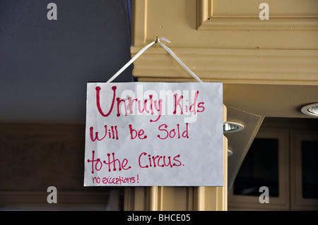 Note in museum saying 'Unruly kids will be sold to the circus. No exceptions.' Stock Photo