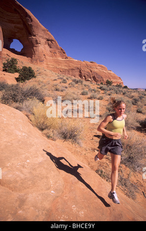 Woman running in the desert. Stock Photo
