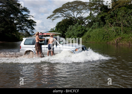 Driving through the river Bongo on the west coast of Costa Rica Stock Photo
