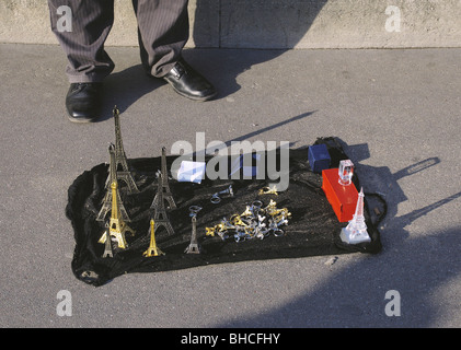 Eiffel Tower Souvenirs on Pavement Stock Photo