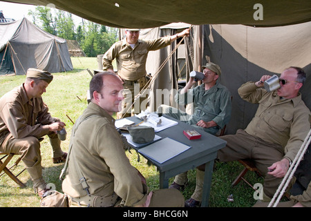 Soldiers relax in front of tent, at Mid-Atlantic Air Museum World War II Weekend and Reenactment in Reading, PA Stock Photo