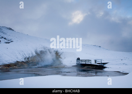 Tourists in a geothermal area in Krisuvik, Iceland. Stock Photo