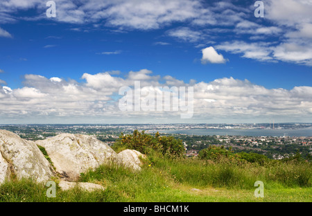 View northwards over Dun Laoighaire and Dublin Bay, from Killiney Hill, with outcrop of Leinster Granite in the foreground Stock Photo