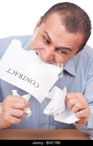 Mad businessman tearing apart a contract with his teeth, isolated on white background Stock Photo