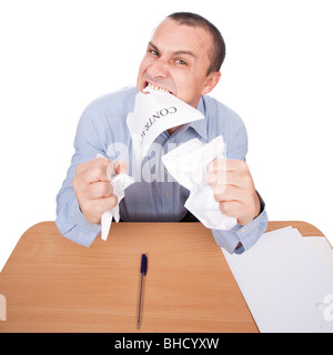 Mad businessman tearing apart a contract with his teeth, isolated on white background Stock Photo