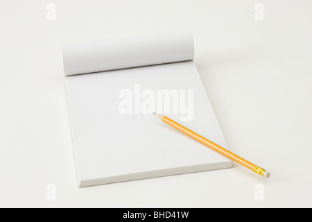 Pencil Computer Notepad Blank notepad and pencil color on a table blackground Stock Photo - Alamy