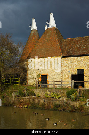 Oast house, with both round and square roofs. Stock Photo