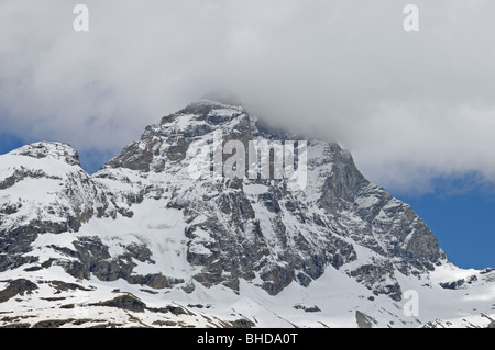 Italian side of the cloud capped Matterhorn or il Monte Cervino from village of Breuil Cervinia Italy Stock Photo